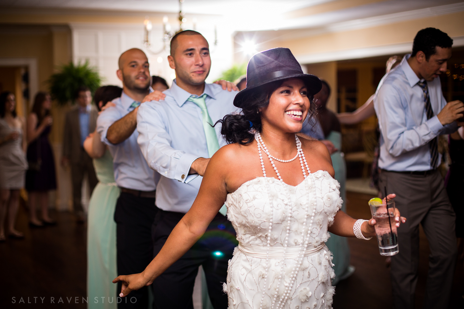 A woman dances at her wedding reception showing real moments and a documentary wedding photography style.