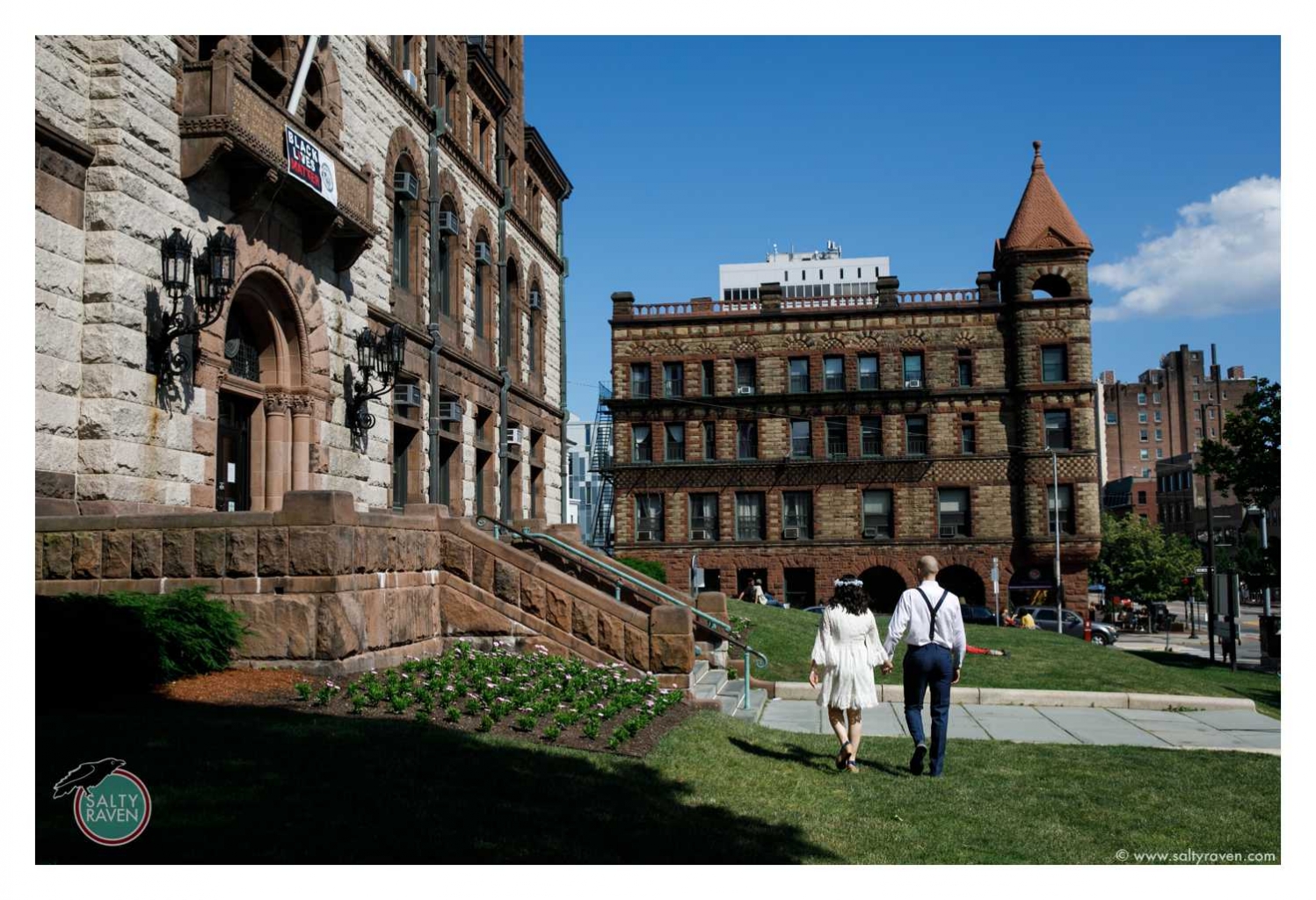 This is the final photo showing them walking away after getting married at Cambridge City Hall.