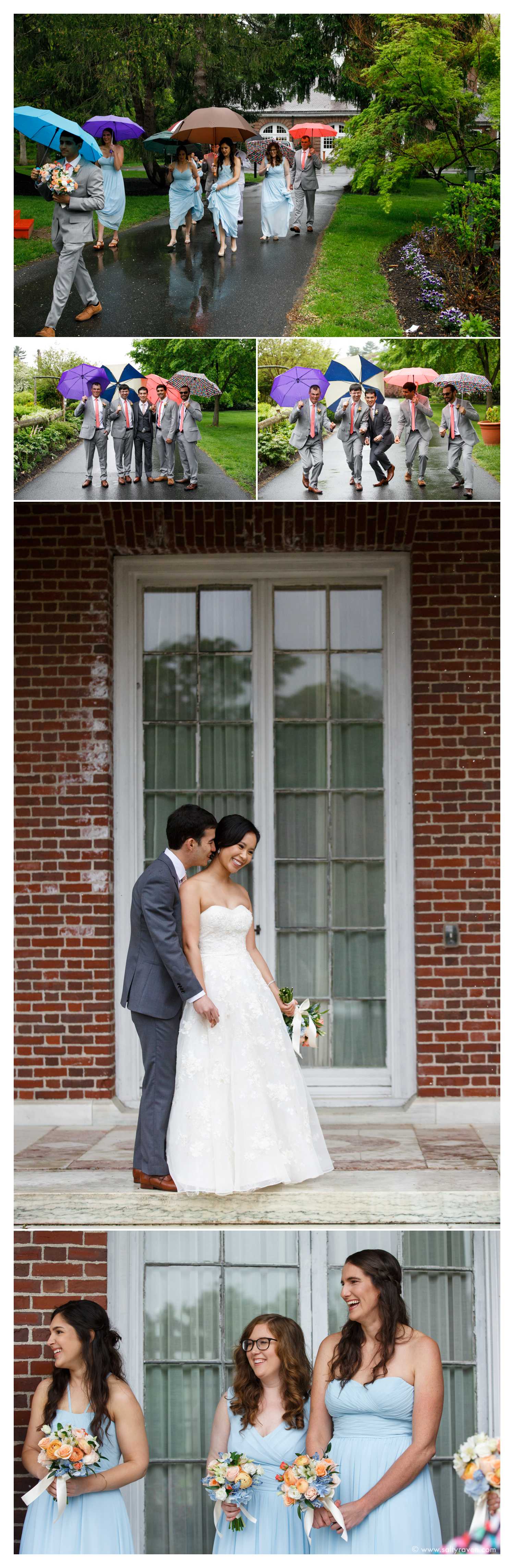 The groomsman hold mismatched umbrellas, the groom snuggles with the bride up against a brick building, and the bridesmaids look on.